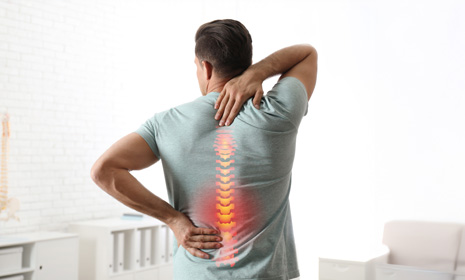 Man experiencing back and spine pain