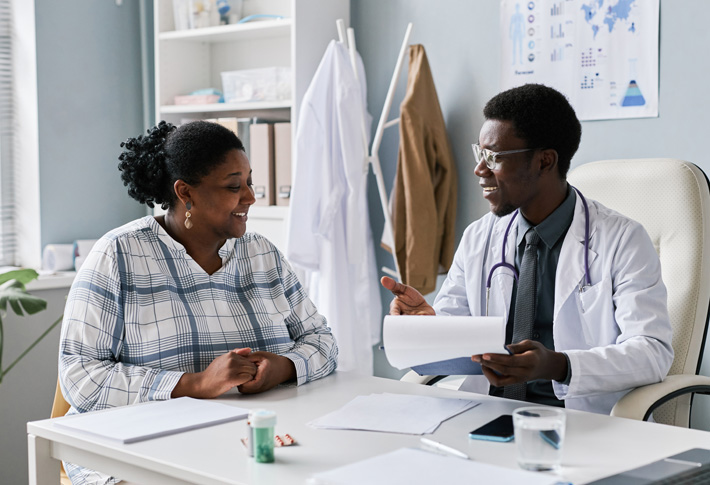Doctor reviewing health information with patient